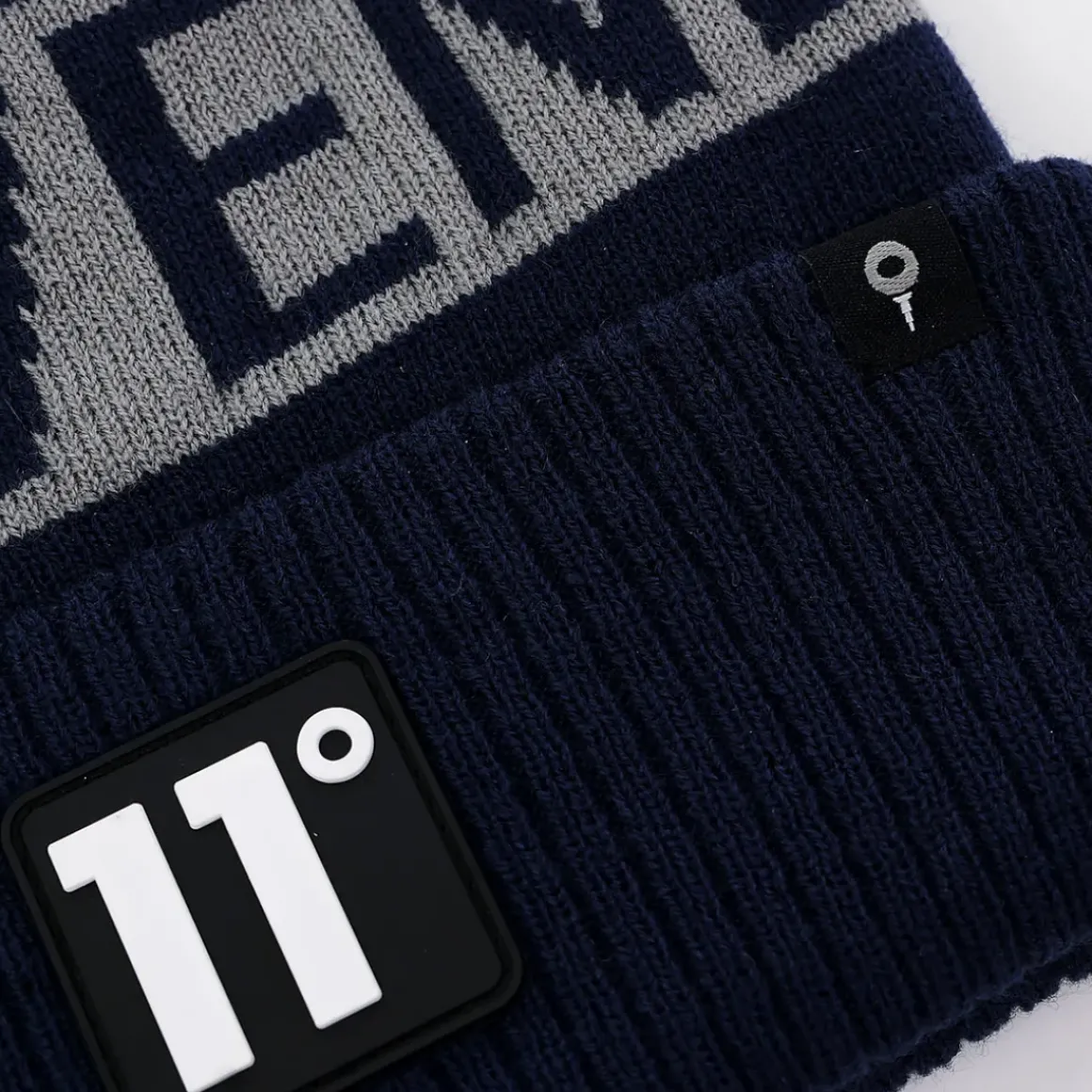 11 Degrees Fleece Lined Graphic POM Golf Beanie