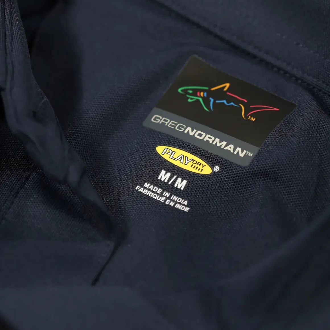 Greg Norman Men's Neck Logo Stretch Golf Polo Shirt