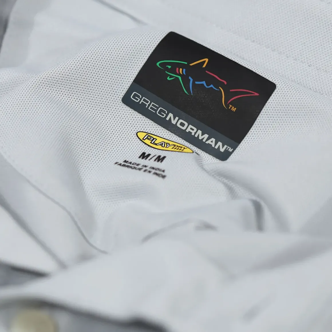 Greg Norman Men's Neck Logo Stretch Golf Polo Shirt